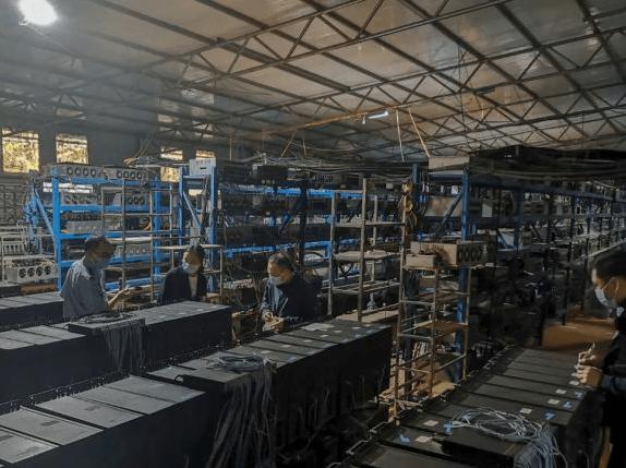 Advanced cryptocurrency mining farm with rows of mining rigs working