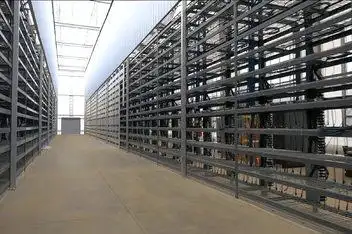 A modern mining farm showcasing rows of mining rigs